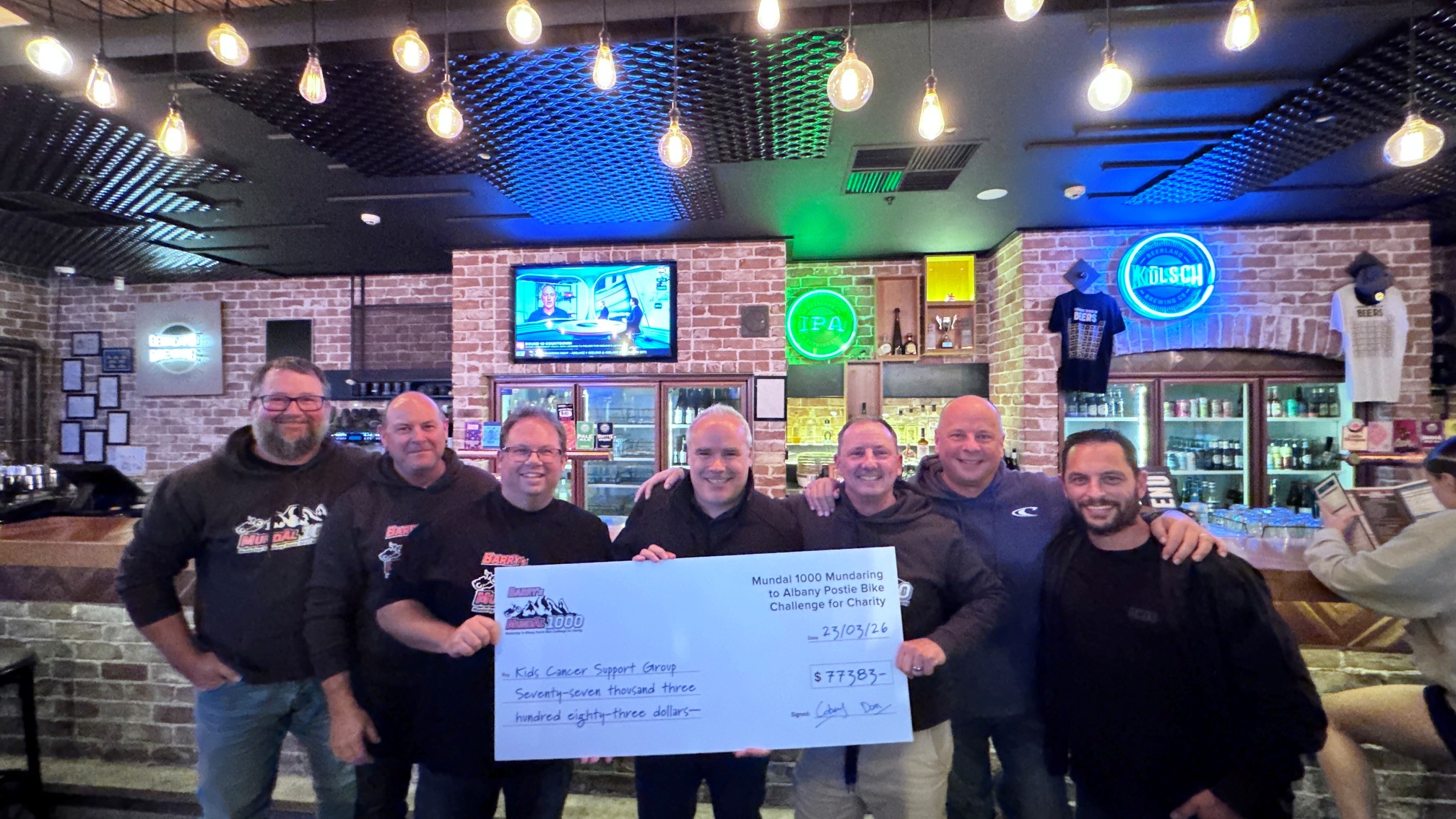 Richard Nell President of KCSG Receiving the cheque for money raised 