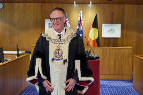 Cr Reynolds in formal mayoral robes.