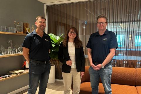 NGIS' Paul Farrel (left) and Nathan Eaton (right) with CLS president Stéphanie Limouzin