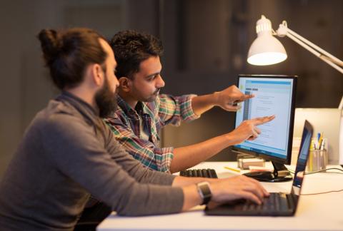 Two men coding