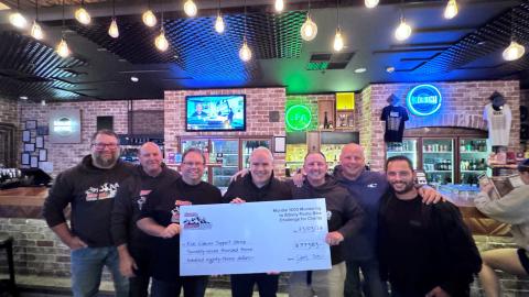 Richard Nell President of KCSG Receiving the cheque for money raised 