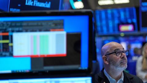 Wall St slips after hot producer inflation data