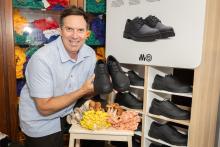 Paul Griffin with his Made Good shoes on sale at the John XXIII College shop. Photo: Michael O’Brien