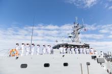 The crew of the Maldives National Defence Force (MNDF) Coast Guard Patrol Boat 24 salute the national flag the Republic of Maldives during a handover ceremony at HMAS Stirling, Western Australia. Photo: Australian Defence Force.